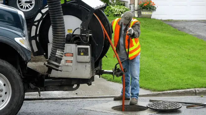 Technician using specialized drainage equipment for sewer line cleaning and foundation protection in Worcester, MA